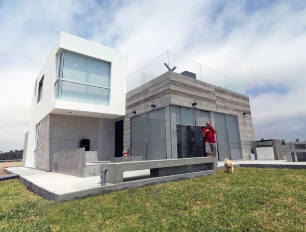 Expansive glass facades offering breathtaking ocean views.