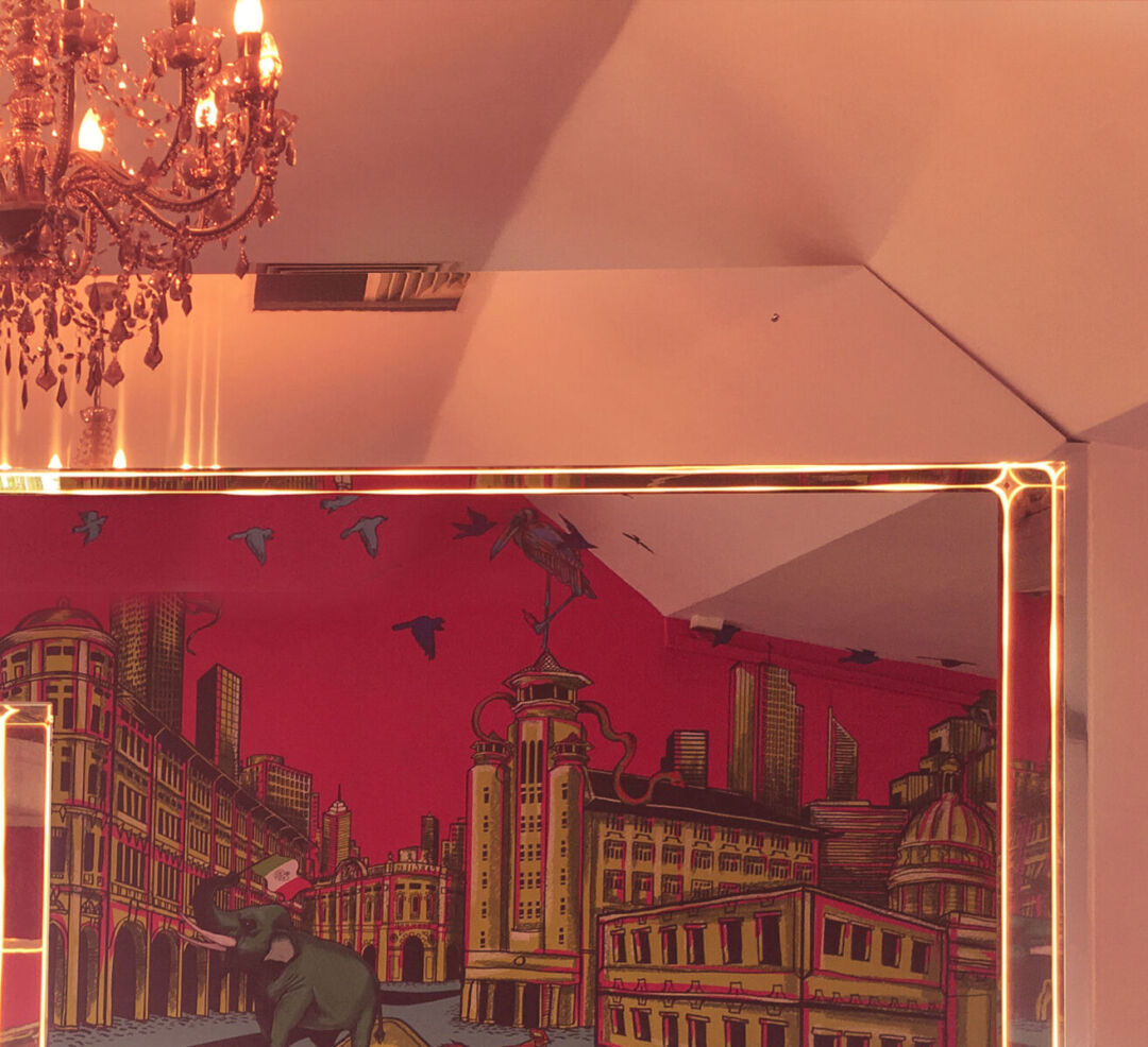 Interior of Clique Lounge Bar featuring vibrant artwork.