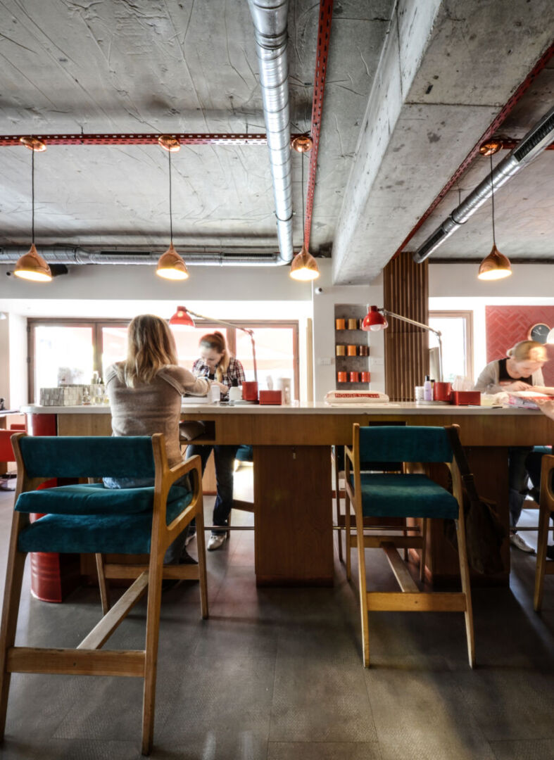 Community table setup fosters interaction among clients.
