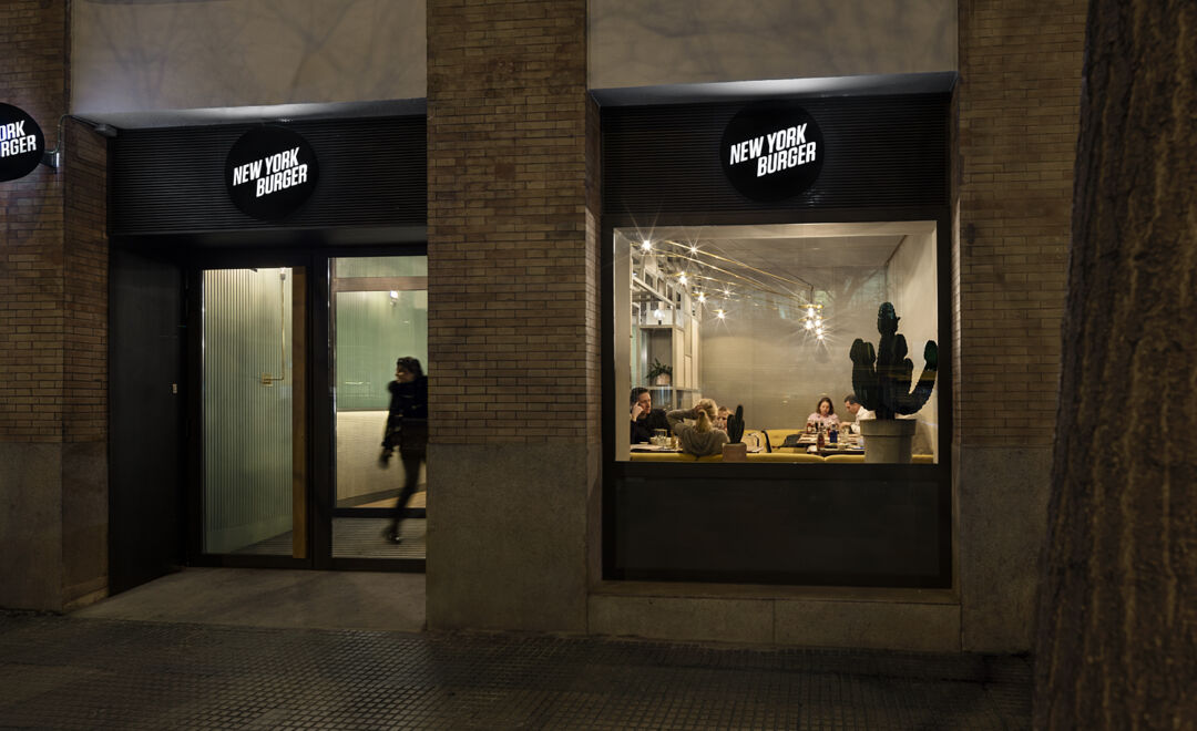 Diners enjoying a lively atmosphere at New York Burger.