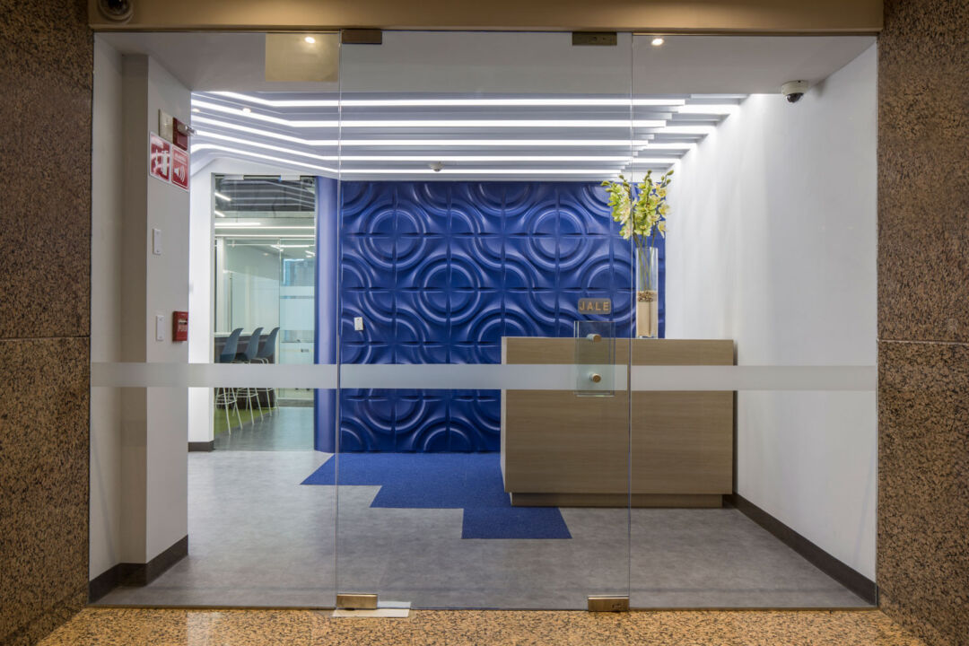Eco-friendly building featuring solar panels and rainwater systems. Eco-friendly building featuring solar panels and rainwater systems.