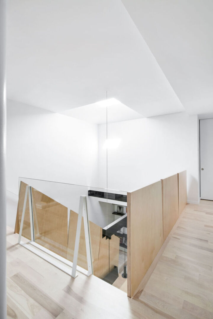 Double-height lightwell illuminating the center of the home.
