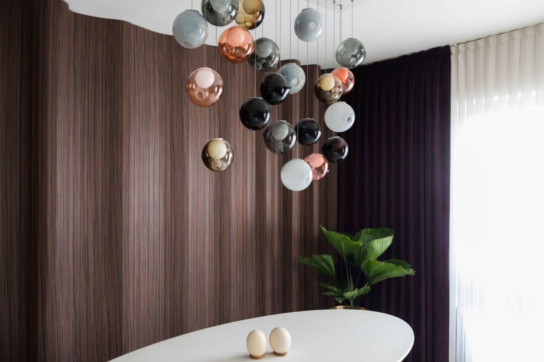 Three-dimensional wood wall adds elegance to the space.