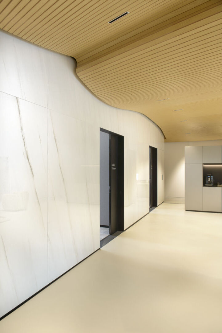 Interior showcasing the wave ceiling design by Atelier Flow. Interior showcasing the wave ceiling design by Atelier Flow.