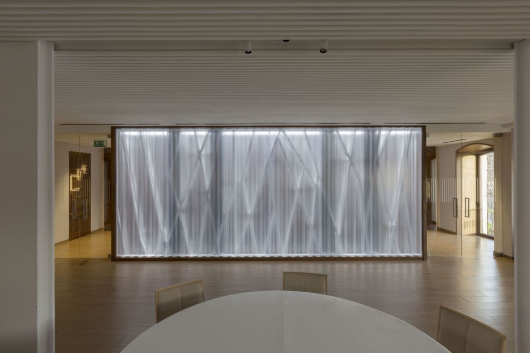 Translucent wall and metal staircase in the restaurant’s lobby. Translucent wall and metal staircase in the restaurant