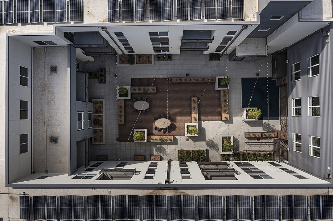 Architectural design with three and four-story buildings. Architectural design with three and four-story buildings.