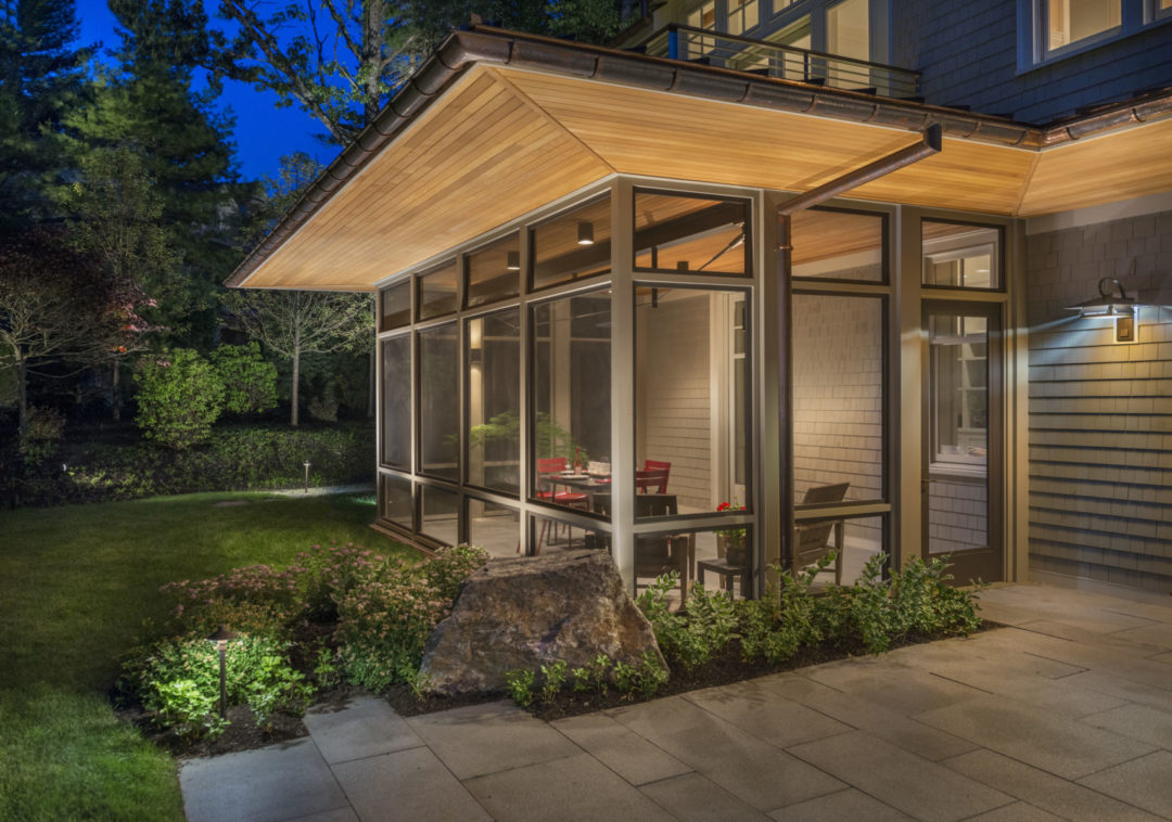 Custom steel truss adds modern flair to the porch structure.