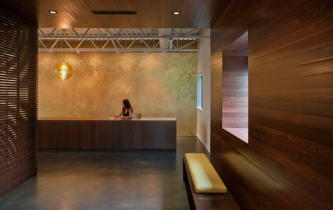 Reclaimed walnut details adding character to the workspace. Reclaimed walnut details adding character to the workspace.